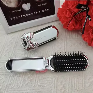 Foldable hair brush with mirror